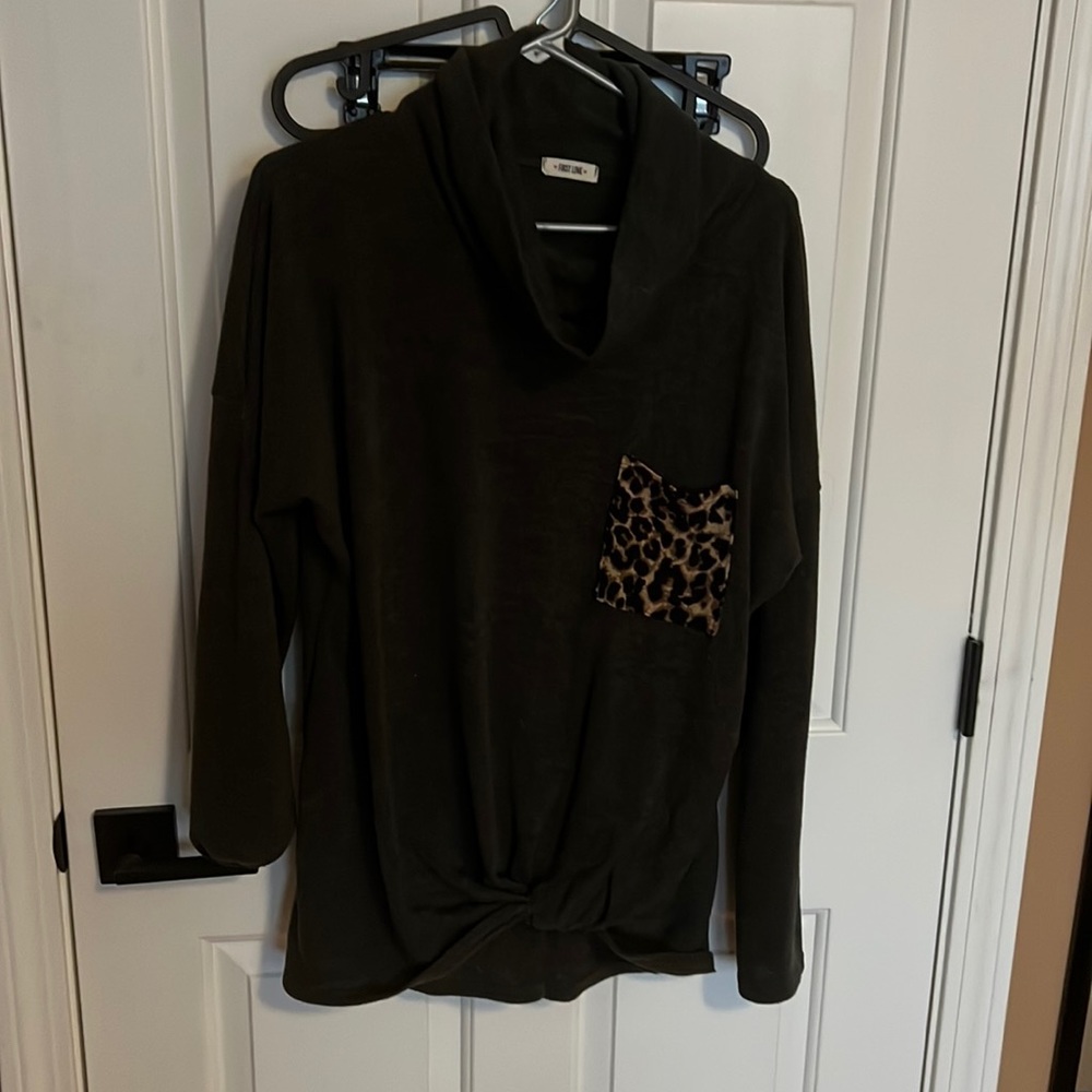 Olive green sweater with leopard print front pocket and a cinched bottom